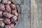 Tuber Jerusalem artichokes on wooden table or background with copy space