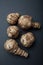 Tubers of Jerusalem artichoke on black background