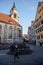 TUBINGEN/GERMANY:JULY 30 2018: A Muslim traveler woman looks happy, walking on the sidewalks of the city of Tubingen near the St.