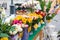 Tubs of fresh colorful cut flowers on sale in a street market