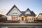 tudor home with front gable at golden hour