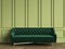 Tufted dark green sofa in classic interior with copy space