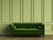 Tufted green sofa in classic interior with copy space.