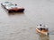 Tug boat service on CHAO PHRAYA river BANGKOK, THAILAND pulling heavy floating container