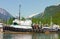 A tug-boat tied alongside a dock in alaska