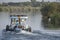 Tug boat towing yacht on nile river in Egypt