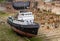 Tug boat under repair in dry dock