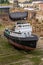 Tug boat under repair in dry dock