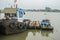 Tug boat with water pumps float on Chaopraya River in Bangkok Thailand