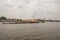 Tug boats with a cargo ship on the Chao Phraya River in Bangkok