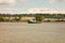 A tug pulling cargo up the fraser river in canada