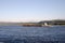 The tug pushes two coupled barges along the wide Columbia River