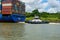 Tug pushing the Cosco  Piraeus shipping freighter on the Panama canal