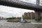 Tug working with barge on East River New York USA