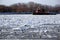 Tugboat Breaking Floating Ice in Frozen River