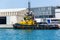 A tugboat moored near a pier