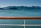 Tugboat pulling barge on a sunny day. Gastineau Channel, Juneau, Alaska, USA.