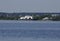 Tugboat pushes sand debris along the river