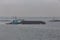 Tugboat pushing barge on the Hudson River