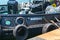 The tugboat stands at the pier in the seaport on a sunny summer day