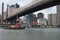 Tugboat under the bridge in New York