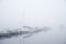 Tugboats in a foggy harbor in Kuopio, Finland