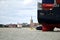 Tugs lead out a container ship from the port from Felixstowe UK