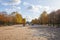 Tuileries garden, large walk with people in a sunny autumn day in Paris