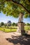 The Tuileries garden in Paris with the statue of Hercule Resting and the Louvre palace