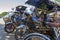 Tuk tuk motorcycles lined up, ready for service and transporting people or tourists through the city.