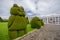 TULCAN, ECUADOR - JULY 3, 2016: animal sculptures located at the side of one path of the cemetery