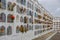 TULCAN, ECUADOR - JULY 3, 2016: vertical graves with a metalic door and flowers on each grave