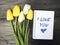 Tulip bouquet and notepad with words I love you