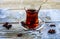 Tulip glass armudu with turkish tea blurred background