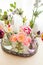 Tulips in glass jars on a tray in white room