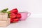 Tulips, presents, cup for mother, wife, daughter, girl. Happy birthday, Mother`s day. Woman`s day. Copy spase