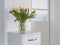 Tulips on a white sideboard