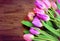 Tulips on a wooden background