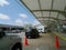 Tulsa International Airport exterior daytime, vehicles in drop off lane