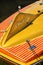 Tulsa OK USA Close-up detail of yellow fin of Chris Craft teak retro speedboat with logo tie to dock in water