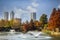 Tulsa USA - View from Central Park of downtown Tulsa Oklahoma on bright autumn day with colorful foliage and lake and