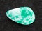 tumbled amazonite gem stone on dark