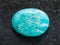 tumbled amazonite gemstone (amazon stone) on dark