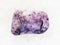 tumbled Amethyst gemstone on white marble