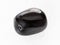 tumbled black Onyx gemstone on white marble