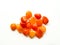 Tumbled carnelian stones on white background for crystal therapy