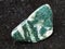 tumbled Chlorite gemstone on dark background