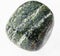 tumbled chrysotile asbestos gemstone on white