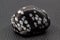 Tumbled close-up snowflake black with light grey spots crystal