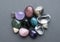 Tumbled gems of various colors. Amethyst, rose quartz, agate, apatite, aventurine, olivine, turquoise,  rock crystal
